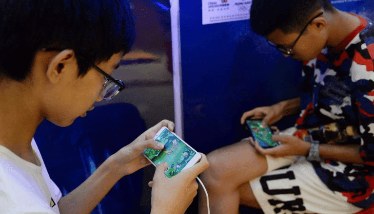 Young Chinese people playing Honor of Kings